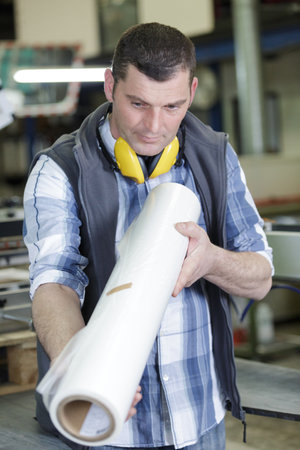 typographer checking printing quality of paperの写真素材