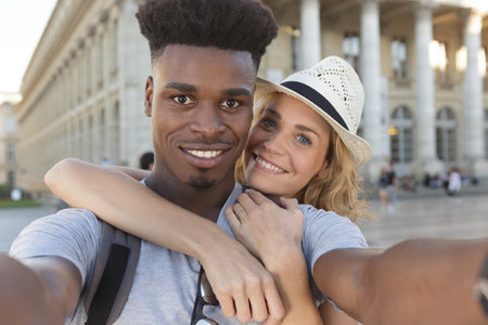tourist couple taking a selfie and smilingの写真素材