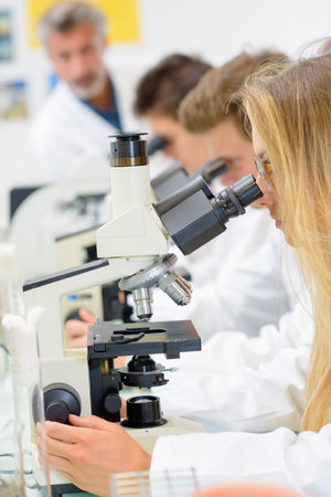 student and teacher in science classの写真素材