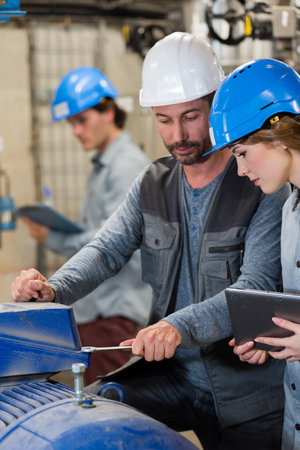 workers controlling and monitoring the processの写真素材
