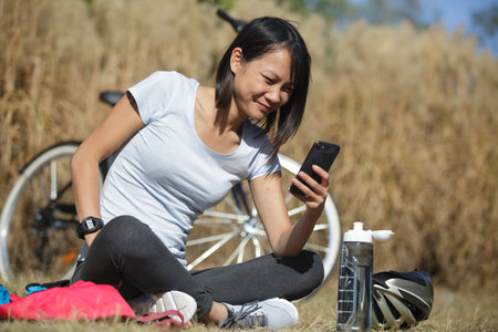a young woman having a biking breakの写真素材