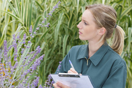 a female gardener with clipboard