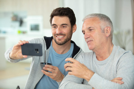 young man and his dad at home