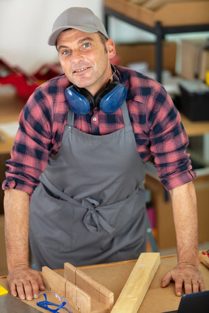 smiling carpenter and small business ownerの写真素材