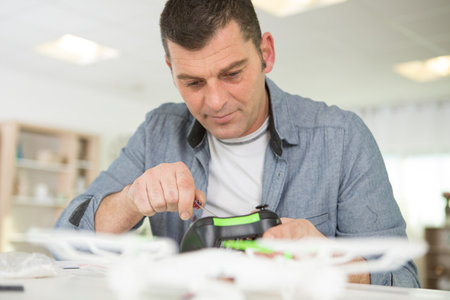 service man fixing drones issuesの写真素材