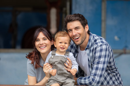 happy family mother father and two children at home