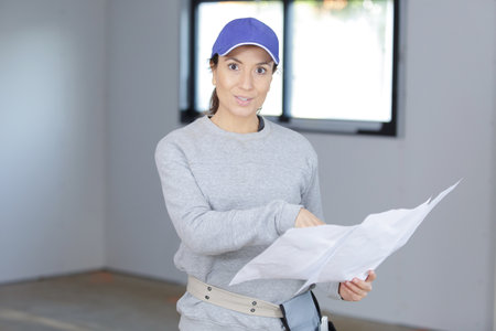 a female engineer checking plansの写真素材