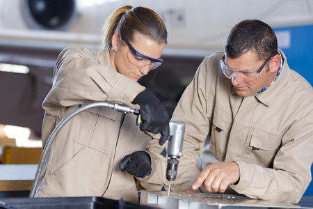 two workers in a steel factory