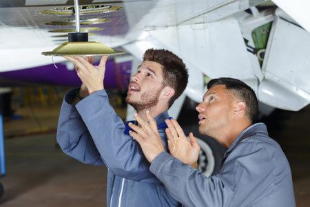 technicians engineers checking the turbine engines airplane