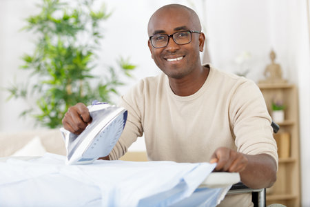 a man during housework and household conceptの写真素材