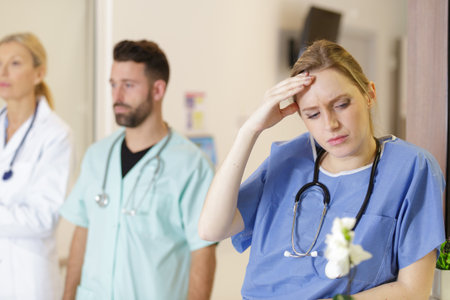 woman nurse suffering from migrainesの写真素材