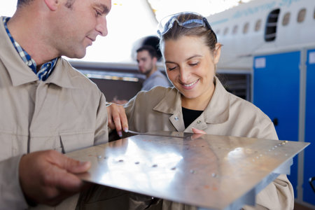 team of workers working with sheet metal