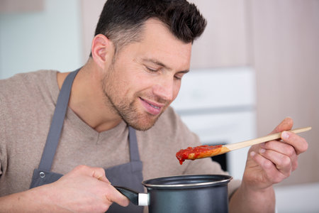 man is making a perfect sauceの写真素材