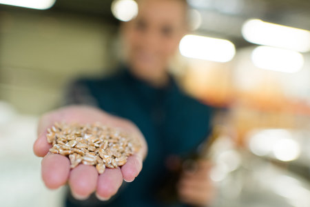 a hand holding some seedsの写真素材