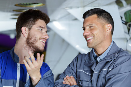 portrait of hangar workers laughingの写真素材