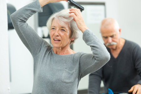 senior woman blowing hair after sports activityの写真素材