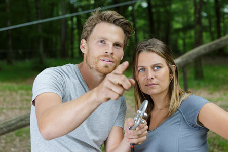 a young couple pointing at somethingの写真素材