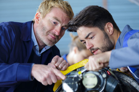 portrait of motorcycle mechanics at work