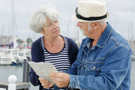 senior couple walking near the sea