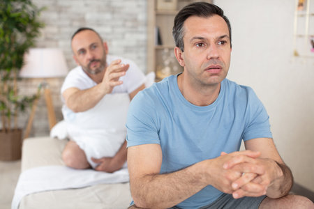 couple having argument with each other in bedroom