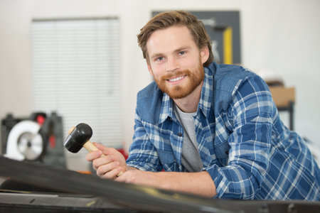 panel beating in a garageの写真素材