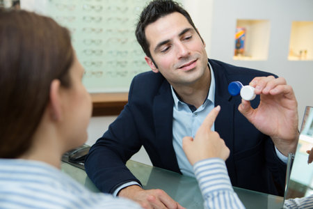 an optician holding contact lensesのeditorial素材