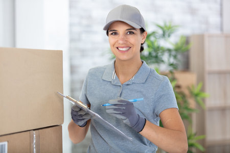 delivery woman holding a clipboard