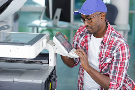 man is testing a printer