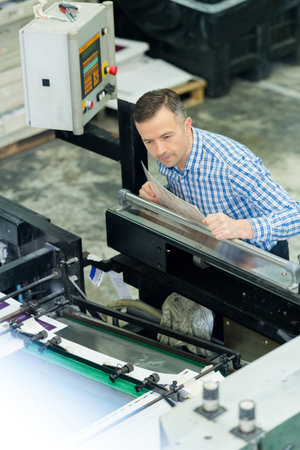 man working in printing factory
