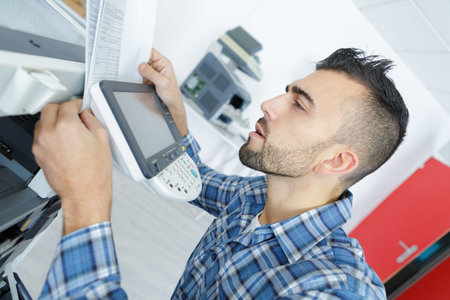 a printer during repair assistance