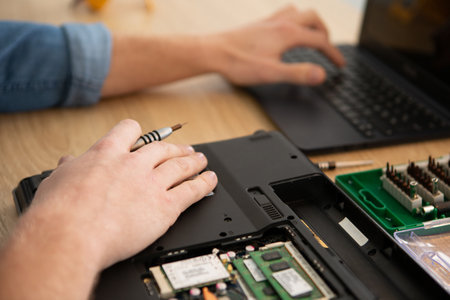 engineer fixing broken computer at workの写真素材