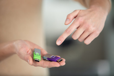 woman hand holding usb flash driveの写真素材