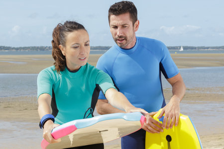 she is learning to bodysurfの写真素材