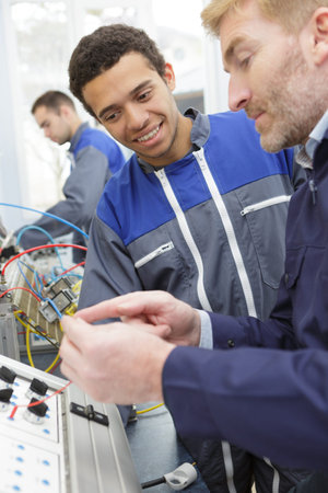 experienced mechanic checking the parts of a car