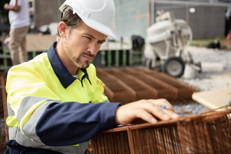 construction worker building foundations focused