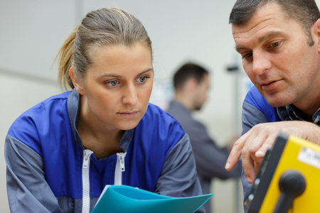 man and woman working in factory