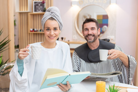 clients with magazines and coffees in a hairdressing salonの写真素材