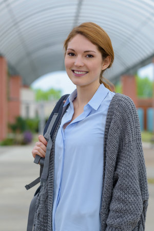 portrait of a smiling female student outdoorの写真素材
