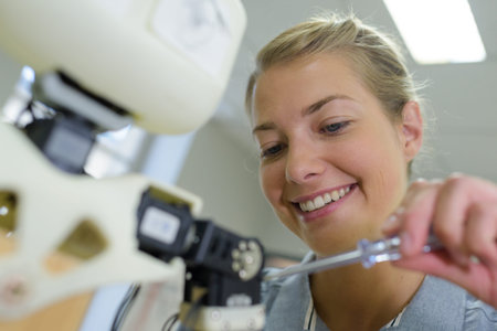 close view of happy woman using a screwdriver