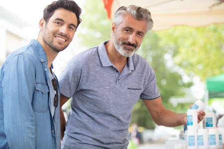 father and son at the market
