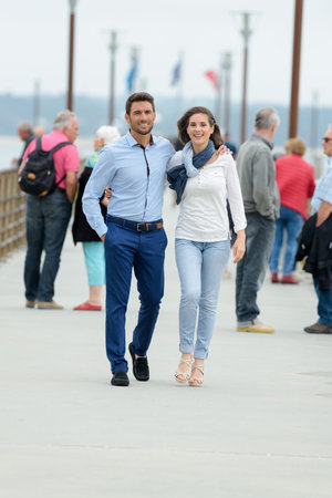 couple walking on the pier