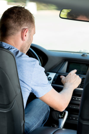 male driver in a modern car