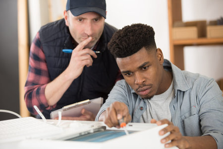 apprentice during metal nut screwの写真素材