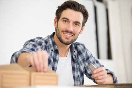man making card board boxes