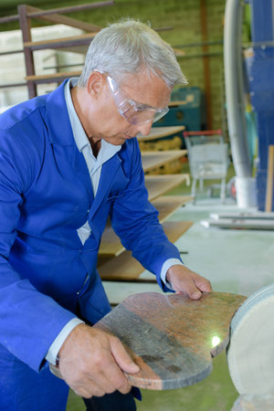 portrait of man in workshopの写真素材