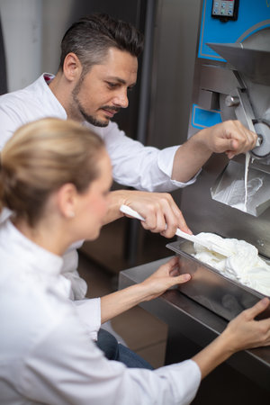 man and woman making ice creamの写真素材