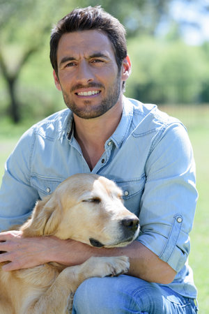 handsome man with dogの写真素材