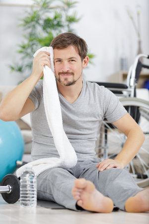 a young man during rehabilitationの写真素材