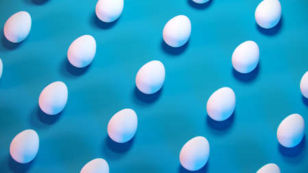 3d trendy easter blue pastel background pattern. Minimal fashion banner with white eggs, creative concept. 3d render. 3d illustration.の写真素材