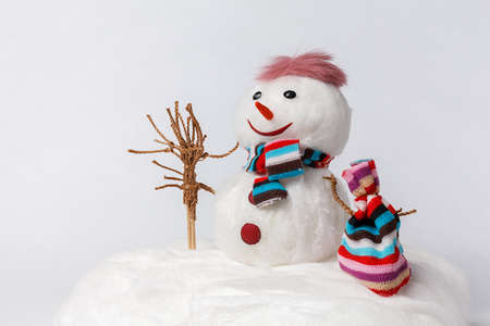Handmade Snowman with a broom and a bagの写真素材